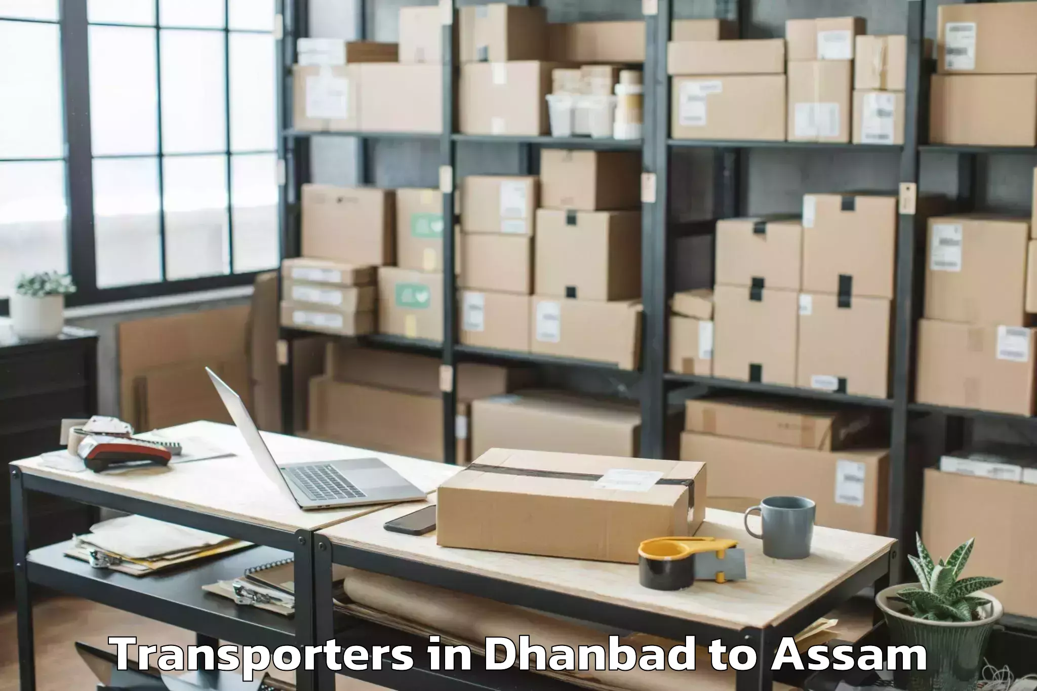 Top Dhanbad to Chaparmukh Transporters Available